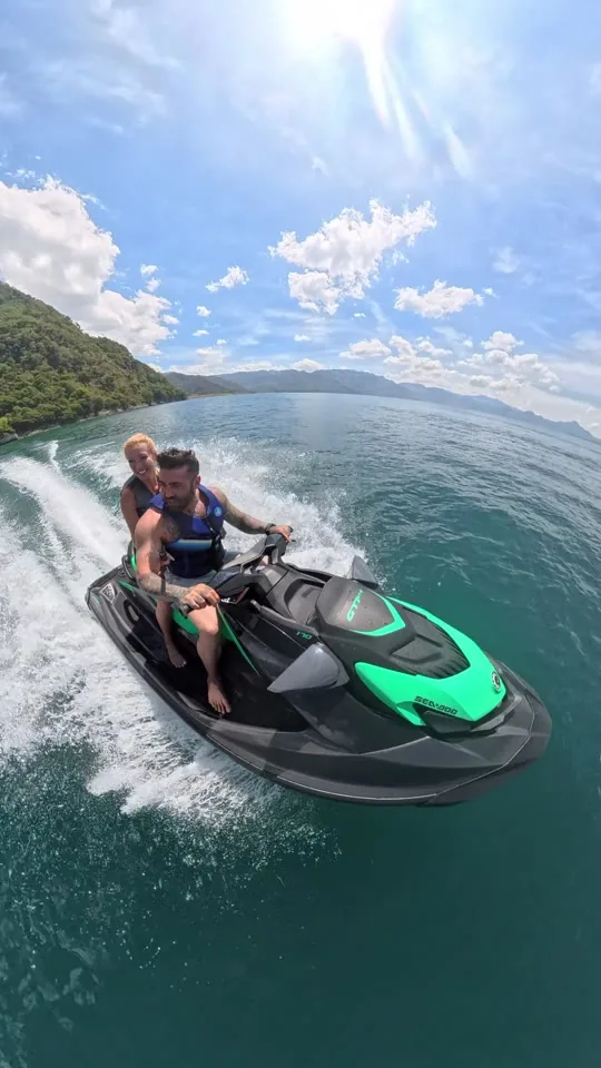Jet ski turning on the green water of Lake Atitlán
